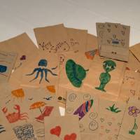 Completed lunch bags decorated by CECI faculty and staff members pile #4